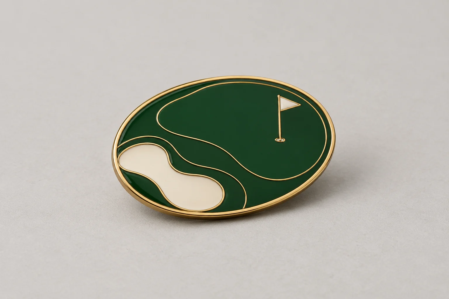 Oval green enamel pin with a cream bunker, fine flagpole and narrow pale brass-colored rim