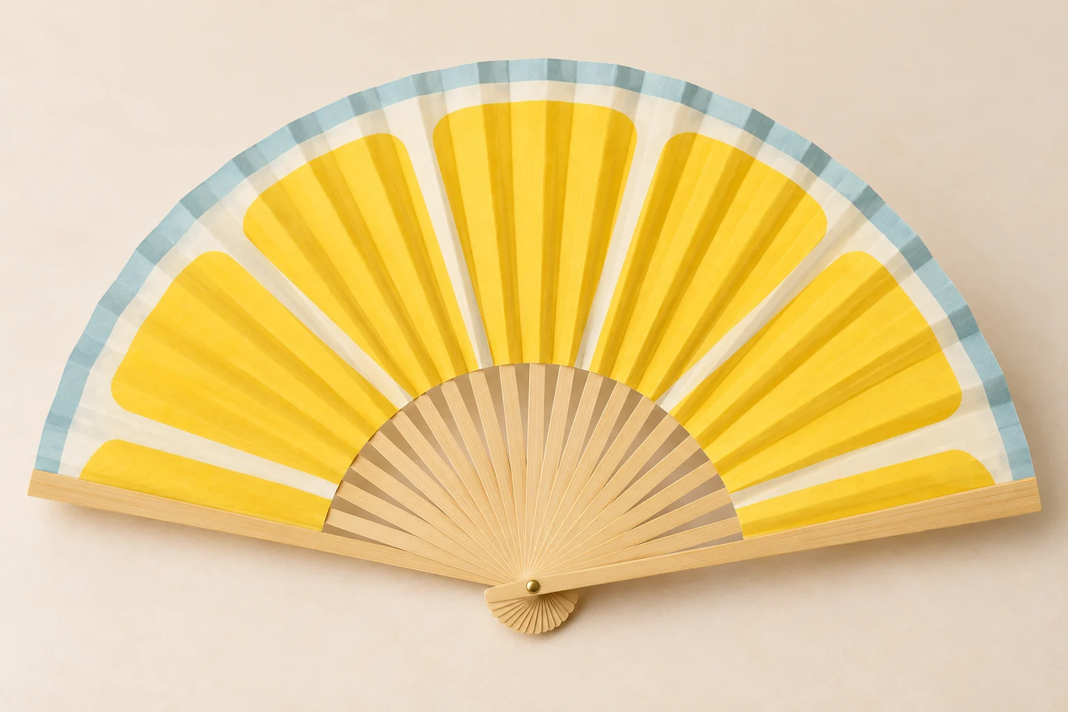 Open paper folding fan with yellow citrus segments, pale-blue edge and bamboo ribs